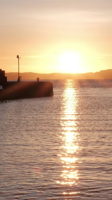Sunset over Firth of Forth showcasing the beauty of the coastline, vertical Stock Footage 302519241