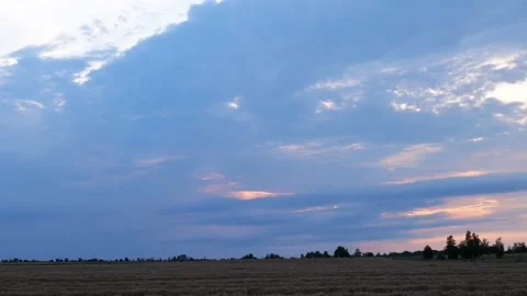 Sunset over the forest and field timelapse Stock Footage 219954069