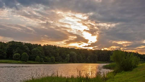 Sunset over the forest lake Stock Footage 98494825