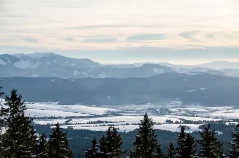 Sunset over Forest Mountains in the Winter Stock Photos