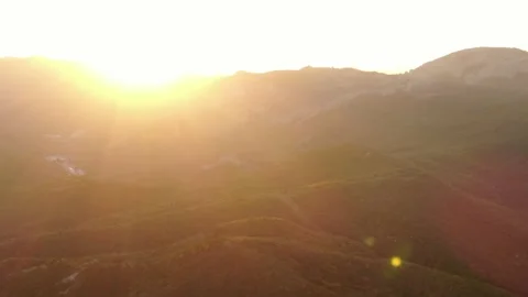 Sunset over a forested mountain range in autumn. Stock Footage 151138252