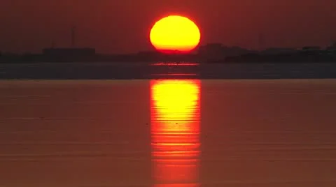 Sunset over frozen lake &amp; skyline Amsterdam Stock-Footage 10869918