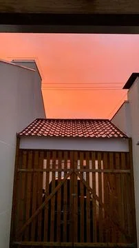 Sunset over garage Stock Photos