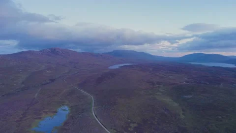 Sunset over Geodha Smoo and Smoo Cave Cliffs from a drone, NC500, Scotland Stock Footage 197536116