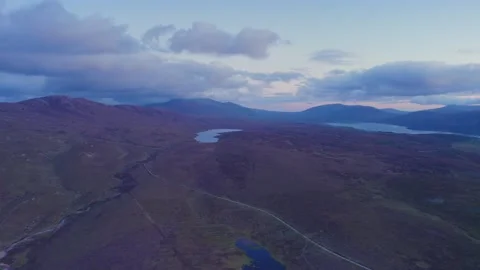 Sunset over Geodha Smoo and Smoo Cave Cliffs from a drone, NC500, Scotland Stock Footage 197536505