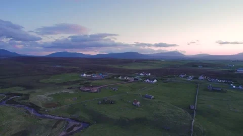 Sunset over Geodha Smoo and Smoo Cave Cliffs from a drone, NC500, Scotland Stock Footage 198952796