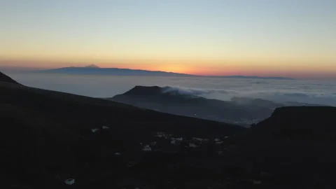 Sunset over Gran Canaria with Teide Volcano Emerging from a Sea of Clouds Stock Footage 313443839