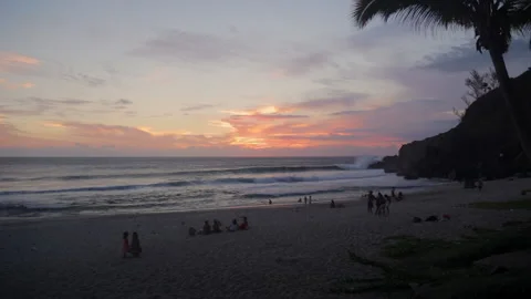 Sunset over Grande Anse beach on Reunion Island with people Stock Footage 143462259