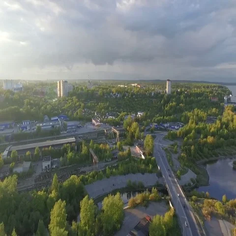 Sunset over a green city with a river Stock-Footage 69550665
