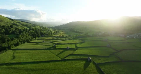 Sunset over green fields in Swaledale Stock Footage 343936515