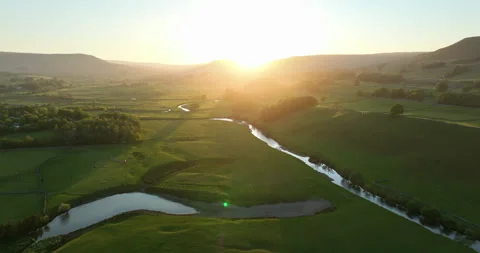Sunset over a green valley Stock Footage 312469098