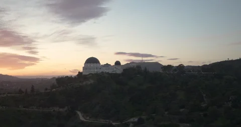 Sunset Over Griffith Observatory Revealing Hollywood Sign In The Background Video stock 270241868