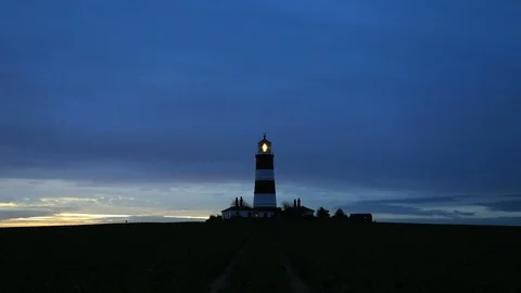 Sunset over Happisburgh Lighthouse Stock Footage 123861257