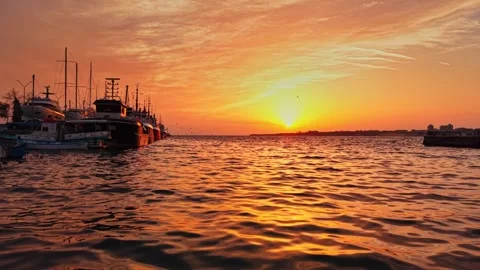 Sunset over the harbor in Nesebar, Bulgaria with colorful sky Stock Footage 322774924
