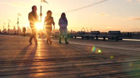 Sunset over harbor pier Stockbeeldmateriaal 64555486