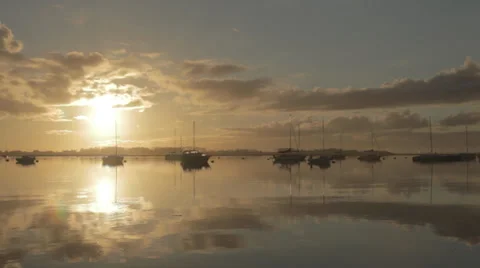 Sunset over Harbour with gently moving water 스톡 동영상 34294093