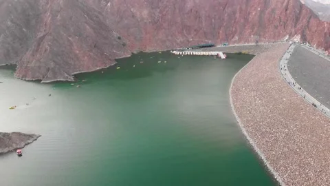Sunset over Hatta dam lake in Dubai emirate of UAE aerial Video stock 130597366