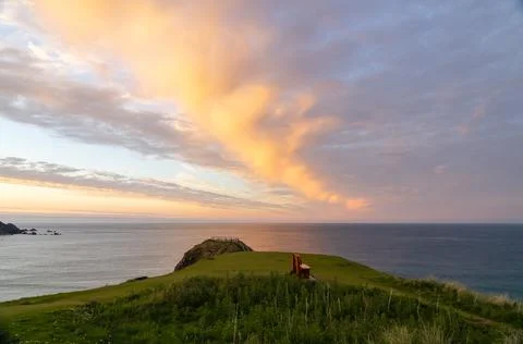 Sunset over the headland Stock Photos