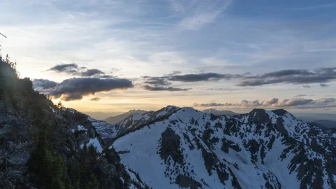 Sunset over high mountain peaks with snow Stock Footage 167116093
