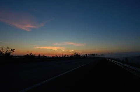 A sunset over a highway Stock Photos