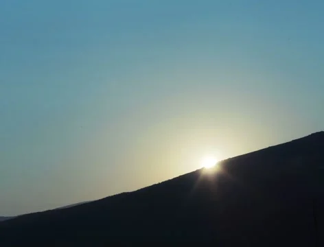 Sunset over hill or mountain silhouette. Sun setting down in nature. Time lapse Stock Footage 62190486
