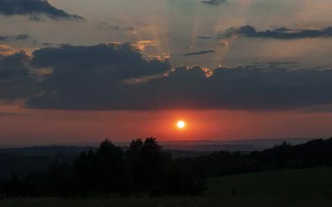 Sunset over the Hills Light Rays Stock Photos