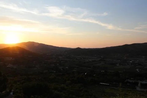 Sunset over the hills Stock Photos