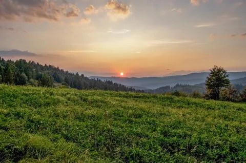 Sunset over the hills Stock Photos
