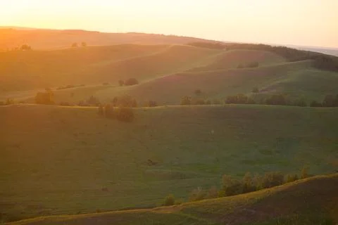 Sunset over the hills Stock Photos