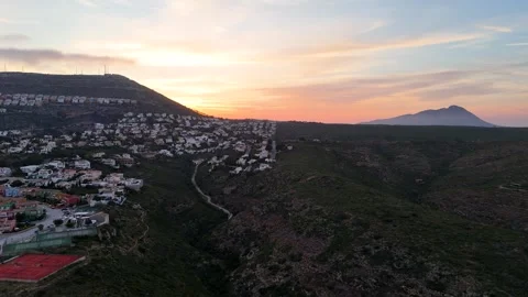 Sunset over Hillside Village and Valley in Cumbre del Sol, Benitachell Spain Stock Footage 340470368