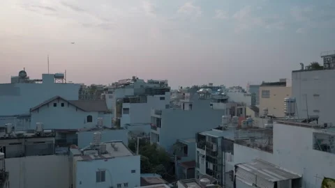 Sunset Over Ho Chi Minh City Rooftops with Blue Buildings Stock Footage 303038448