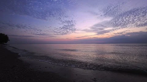 Sunset over the horizon of a sandy beach on a tropical island in Thailand Stock Footage 332212386