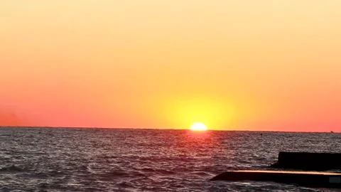 Sunset over the horizon at sea. Orange sunset Stock Footage 217814909