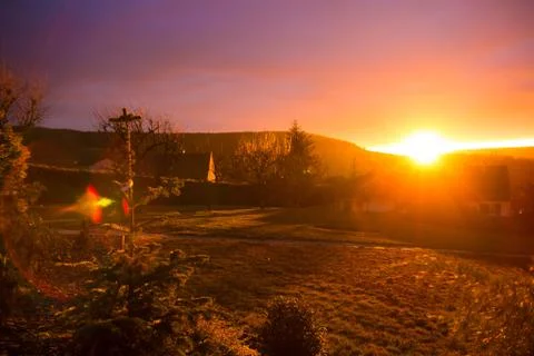 Sunset over the house Stock Photos