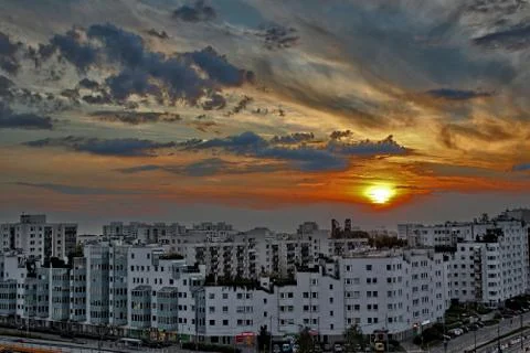 Sunset over housing blocks Stock Photos