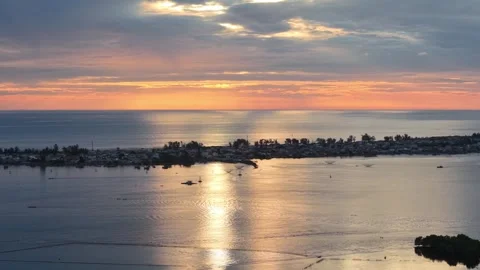 Sunset over Hue lagoon with calm reflections aerial 4K Stock Footage 339864237