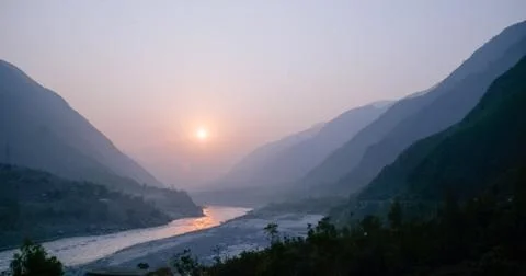 Sunset over Indus river and layers of Karakoram mountain range. Stock Photos