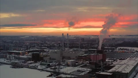 Sunset over Industrial Complex in Winter with Drone Stock Footage 159480050