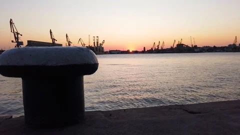 Sunset over Industrial cranes and cargo ships. Stock Footage 114513617