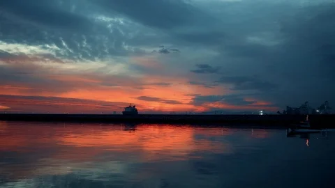Sunset over an industry harbor with cranes and cargo ship in Port of Burgas 4k 스톡 동영상 122671163