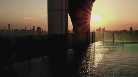 Sunset Over an Infinity Swimming Pool Condominium in Bangkok, Thailand. Stock Footage 290880946