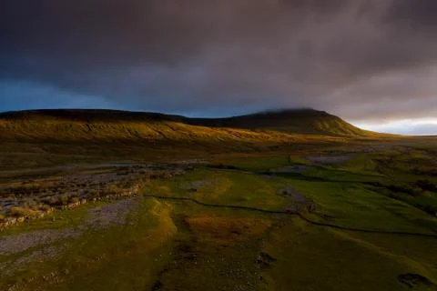 Sunset over Ingleborough is the second-highest mountain in the Yorkshire Dale Stock Photos