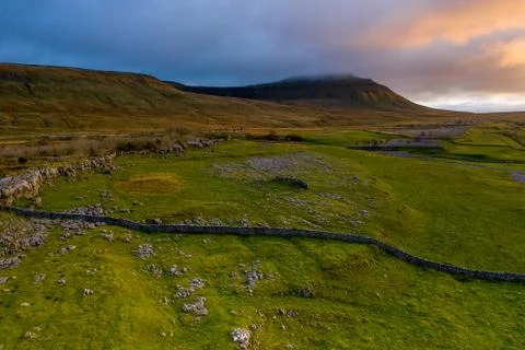 Sunset over Ingleborough is the second-highest mountain in the Yorkshire Dale Stock Photos
