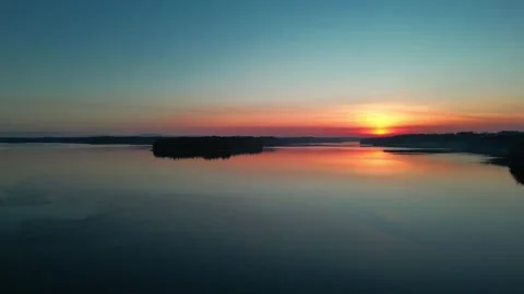 Sunset over island in distance Stock Footage 294708195