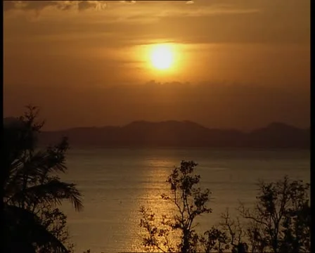 Sunset over island Stock Footage 11212779