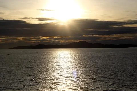 Sunset over island Stock Photos