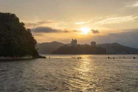 Sunset over the island Stock Photos