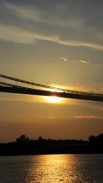 Sunset over Istanbul bridge, creating a serene and golden sky backdrop. Stock Photos
