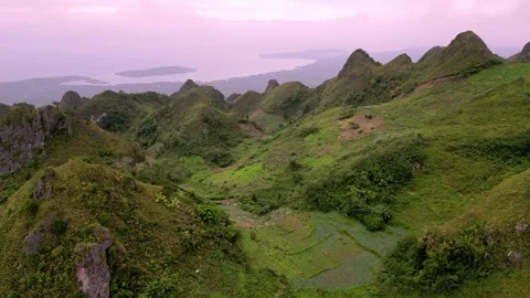 Sunset Over karst Green and brown Terrain. Evening Scene Featuring Distant Stock Footage 339335683