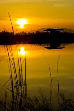 Sunset over lagoon Stock Photos